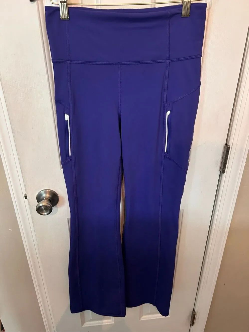 Athleta Rainier Bootcut Pants blue/purple featuring zippered side pockets